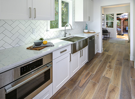 Long kitchen with angled tile backsplash
